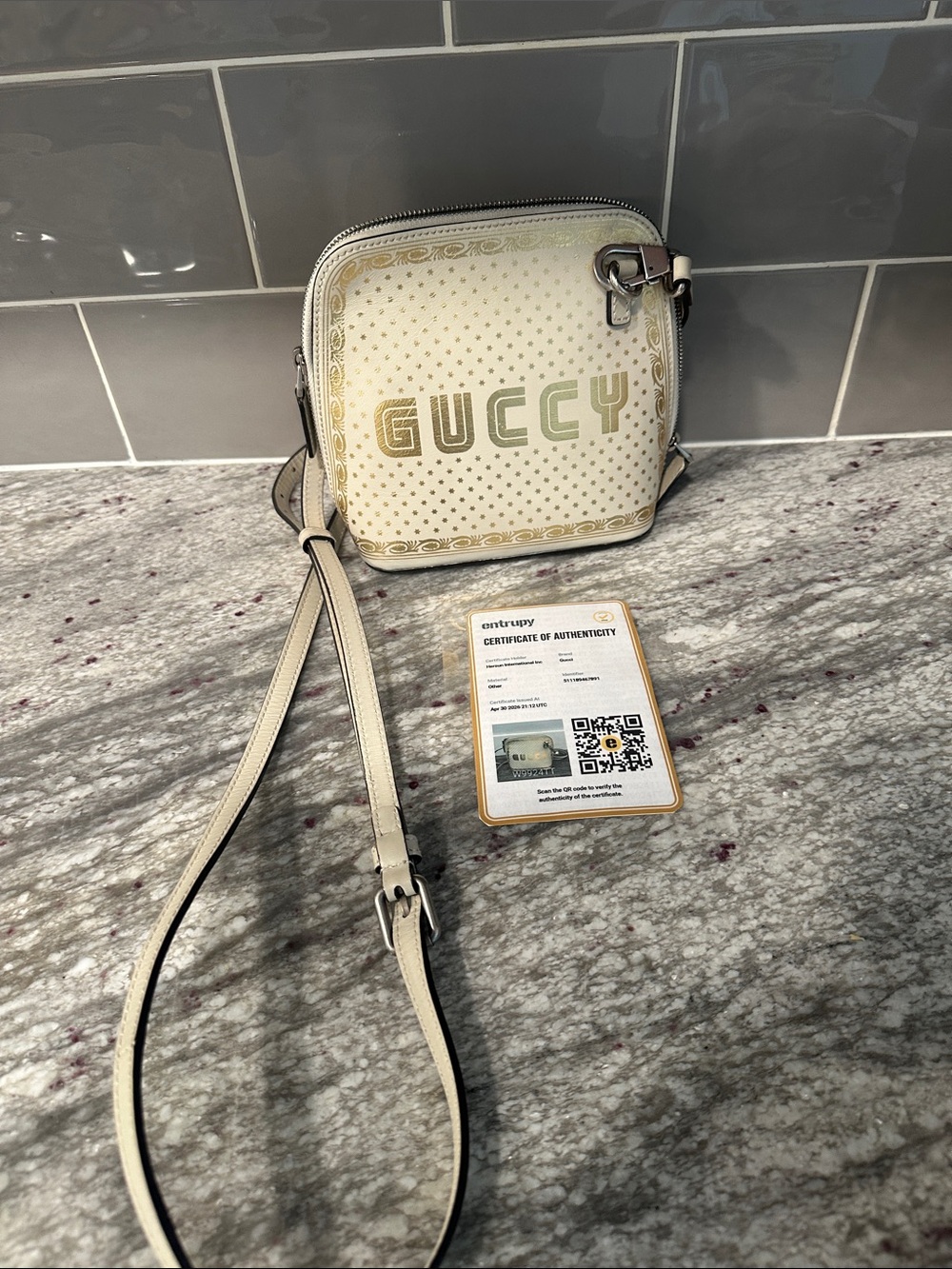 Gucci Guccy X Sega Limited Edition 
Cream and Gold Logo Crossbody Bag
